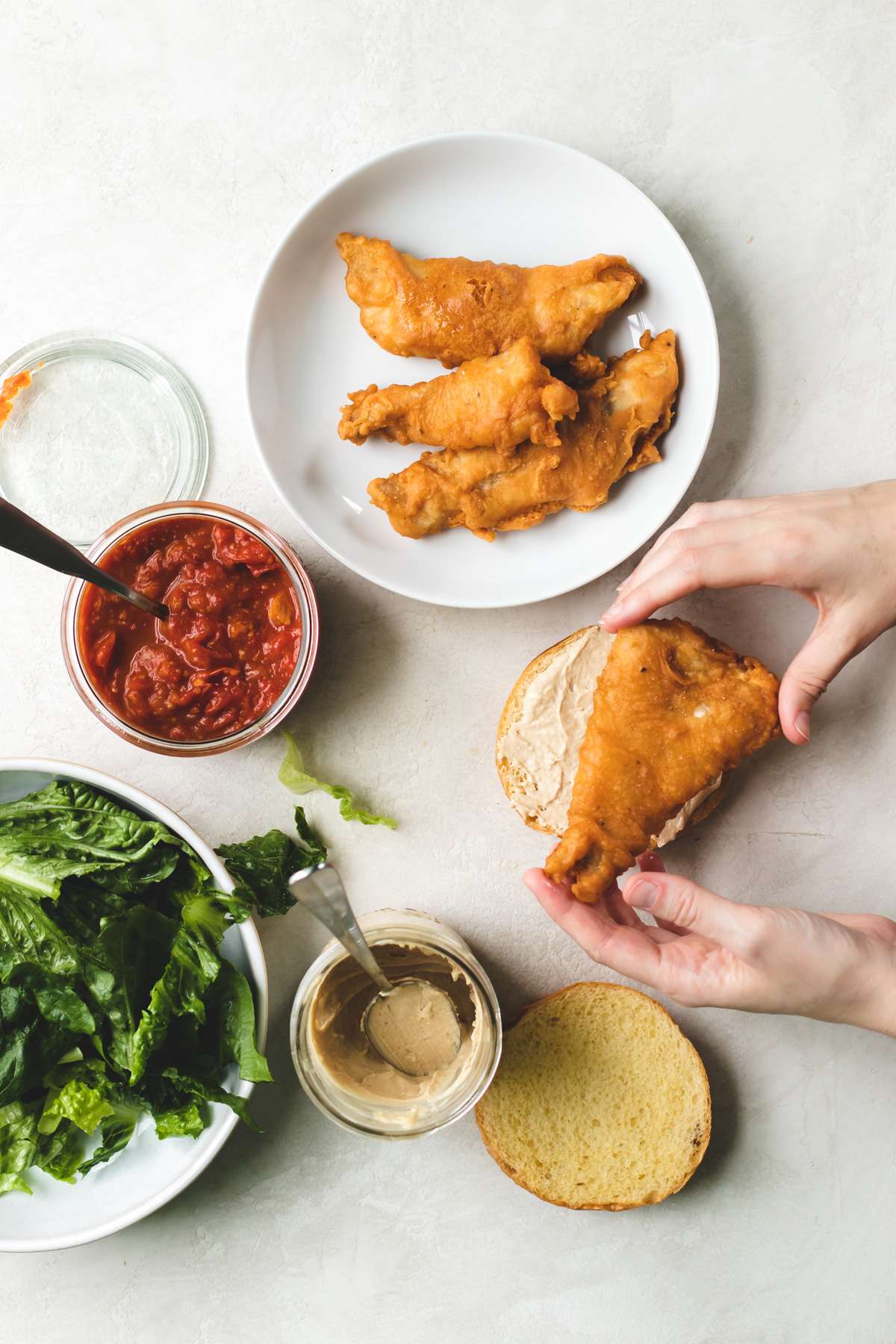 Beer Battered Fish Sandwich with Tahini Sauce and Tomato Relish The